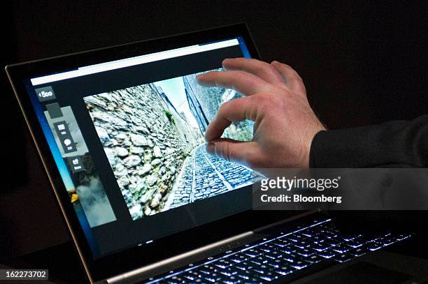 An attendee tries out the new Google Inc. Chromebook Pixel laptop during a launch event in San Francisco, California, U.S., on Thursday, Feb. 21,...
