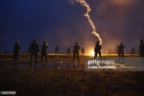 Female Marines learn night-fire techniques during a combat marksmanship course at Marine Combat Training on February 20, 2013 at Camp Lejeune, North...