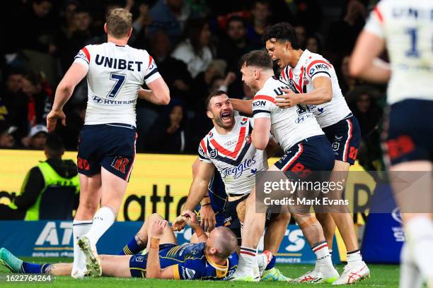 James Tedesco of the Roosters celebrates a try with team mates during the round 25 NRL match between Parramatta Eels and Sydney Roosters at CommBank...