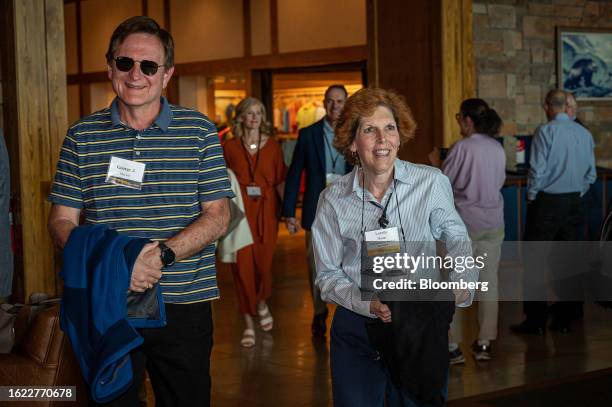 Loretta Mester, president and chief executive officer of the Federal Reserve Bank of Cleveland, right, arrives for dinner during the Jackson Hole...