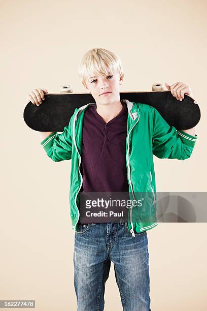 blond boy with skateboard - skater boy hair stock pictures, royalty-free photos & images