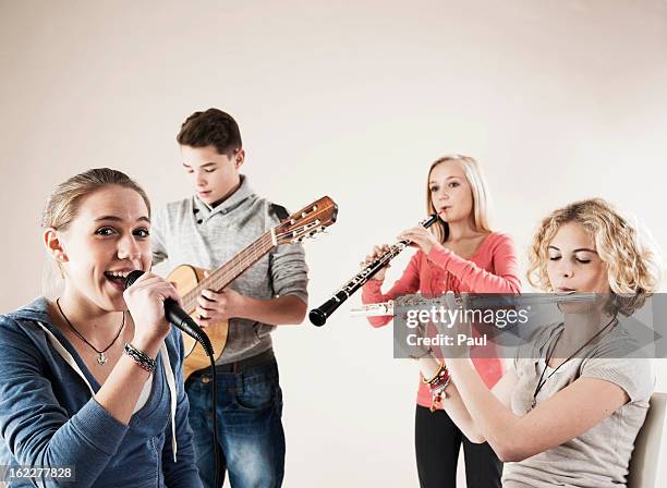 teenager playing music - teenagers only stock pictures, royalty-free photos & images