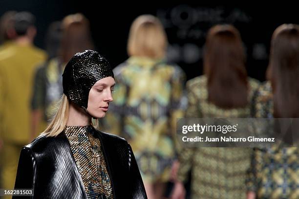 Models showcase designs by Martin Lamothe on the runway at the Martin Lamothe show during Mercedes Benz Fashion Week Madrid Fall/Winter 2013/14 at...