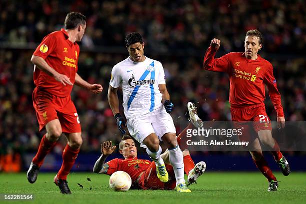 Hulk of Zenit charges through the liverpool defence of Jamie Carragher, Daniel Agger and Lucas of Liverpool during the UEFA Europa League round of 32...