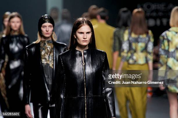 Models showcase designs by Martin Lamothe on the runway at the Martin Lamothe show during Mercedes Benz Fashion Week Madrid Fall/Winter 2013/14 at...