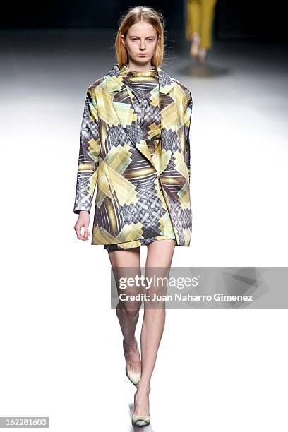 Model showcases designs by Martin Lamothe on the runway at the Martin Lamothe show during Mercedes Benz Fashion Week Madrid Fall/Winter 2013/14 at...