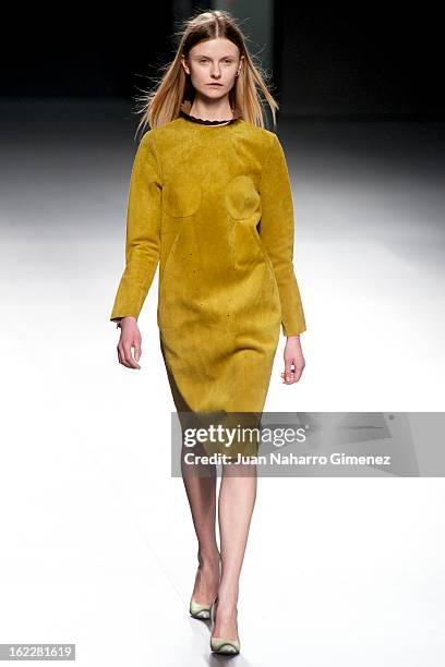 Model showcases designs by Martin Lamothe on the runway at the Martin Lamothe show during Mercedes Benz Fashion Week Madrid Fall/Winter 2013/14 at...
