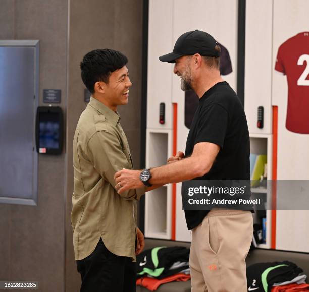 Wataru Endo new signing of Liverpool with Jurgen Klopp manager of Liverpool at AXA Training Centre on August 18, 2023 in Kirkby, England.