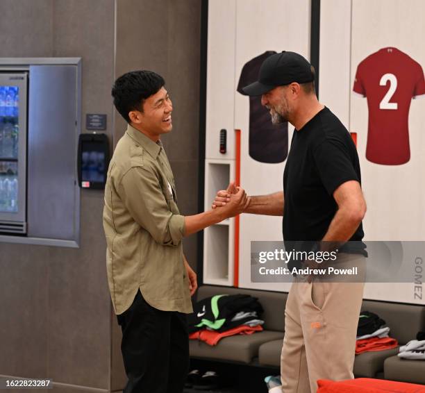 Wataru Endo new signing of Liverpool with Jurgen Klopp manager of Liverpool at AXA Training Centre on August 18, 2023 in Kirkby, England.