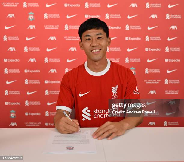 Wataru Endo new signing of Liverpool at AXA Training Centre on August 18, 2023 in Kirkby, England.