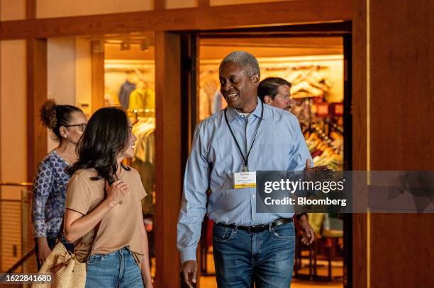 Raphael Bostic, president and chief executive officer of the Federal Reserve Bank of Atlanta, right, arrives for dinner during the Jackson Hole...