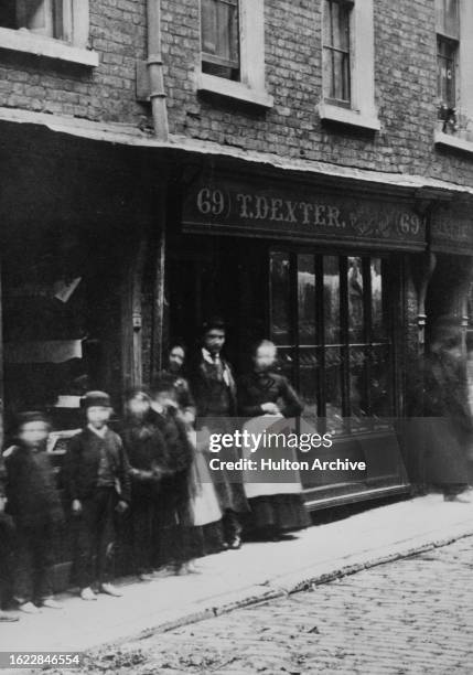 Crowd of people stand outside Arthur Orton, the Tichborne Claimant's house at 69 Wapping, London, circa 1870.