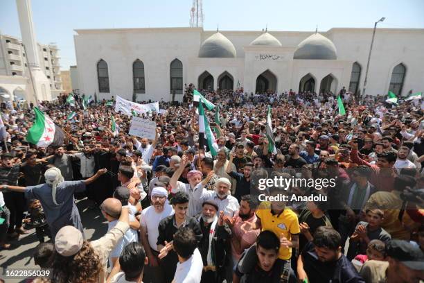 People gather to protest against Bashar al-Assad regime in al-Bab district of Aleppo, Syria on August 25, 2023. Thousands of people gathered in...