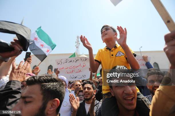 People gather to protest against Bashar al-Assad regime in al-Bab district of Aleppo, Syria on August 25, 2023. Thousands of people gathered in...