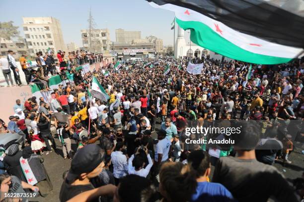 People gather to protest against Bashar al-Assad regime in al-Bab district of Aleppo, Syria on August 25, 2023. Thousands of people gathered in...