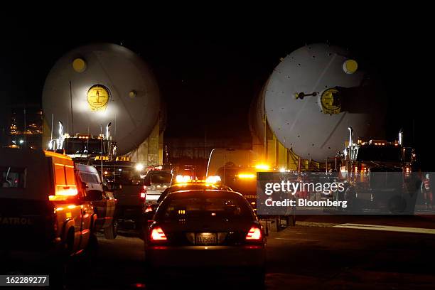 Steel coke drums sit on trailers manufactured by Mammoet Salvage BV before being transported to a Chevron Corp. Refinery in Redondo Beach,...