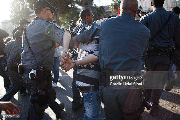 Supporter of Samer al-Issawi, a Palestinian prisoner who is on a hunger strike, is arrested by Israeli police during clashes following a...