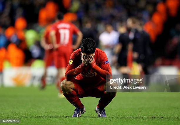 Dejected Luis Suarez of Liverpool reacts as his team win on the night but exit the competition during the UEFA Europa League round of 32 second leg...