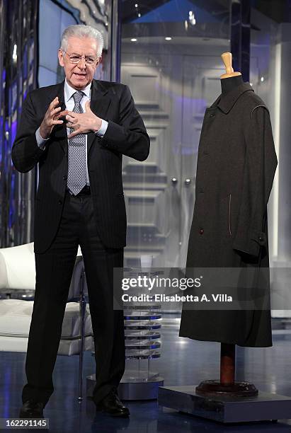 Italian Prime Minister Mario Monti poses with a Loden coat during filming for the 'A Porta A Porta' TV Show on February 21, 2013 in Rome, Italy....