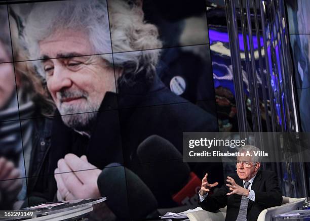 Italian Prime Minister Mario Monti during filming for the 'A Porta A Porta' TV Show while a portrait of Beppe Grillo is displayed on February 21,...