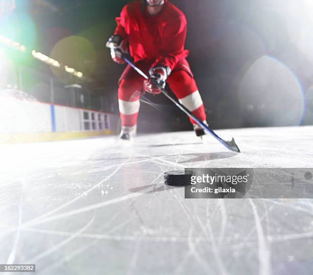 ice hockey player. - hockey puck stock pictures, royalty-free photos & images