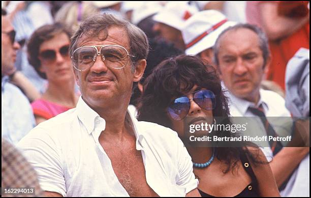 Jean-Paul Belmondo and girlfriend Carlos Sotto Mayor at Roland Garros, 1982.