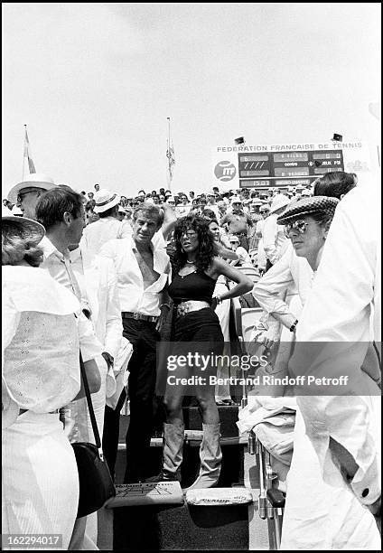 Roland Garros tennis tournament : Jean-Paul Belmondo and Carlos Sotto Mayor .