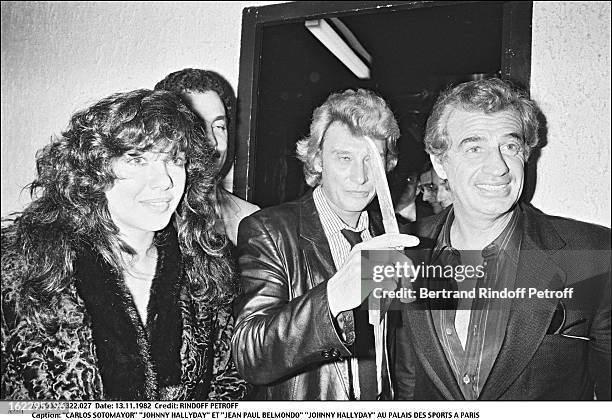 Carlos Sottomayor, Johnny Hallyday and Jean-Paul Belmondo in Johnny's dressing room the night of his concert in Palais Des Sports, Paris .