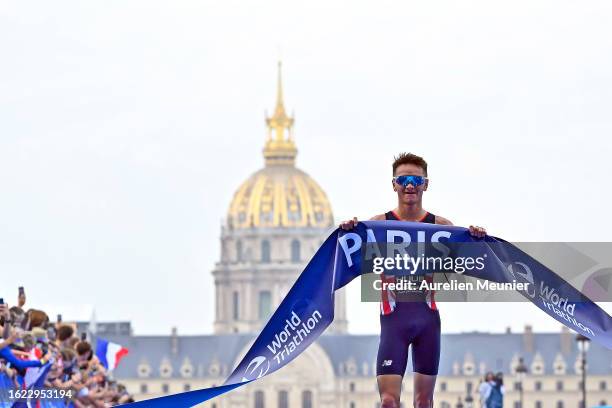 Alex Yee of Great Britain reacts as he finishes first on Pont Alexandre III in front of Les Invalides during the Men World Triathlon Championship...