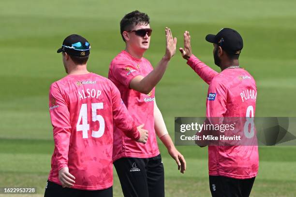 Jack Carson of Sussex celebrates with team mate Cheteshwar Pujara after dismissing James Bracey of Gloucestershire during the Metro Bank One Day Cup...