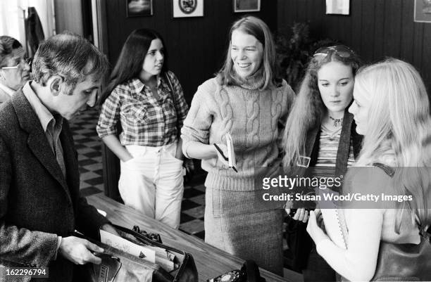American military analyst and political activist Daniel Ellsberg chats with a group of female students after an interview in an office on the...