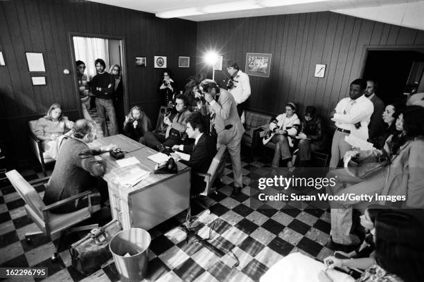 As students watch, American military analyst and political activist Daniel Ellsberg is interviewed and photographed in an office on the University of...