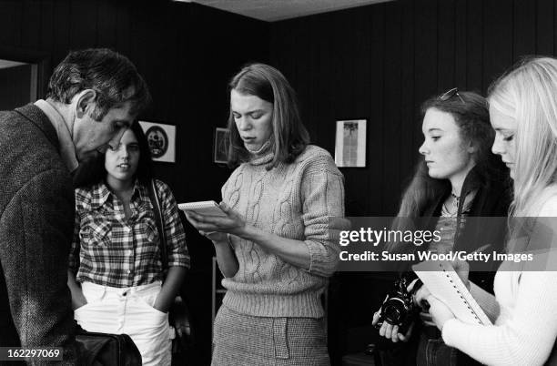 American military analyst and political activist Daniel Ellsberg chats with a group of female students after an interview in an office on the...