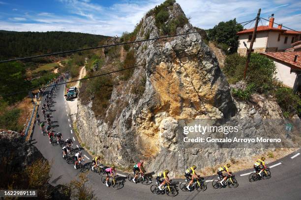 Primoz Roglic of Slovenia and Team Jumbo-Visma - Purple Leader Jersey and a general view of the peloton passing through Frias Village during the 45th...