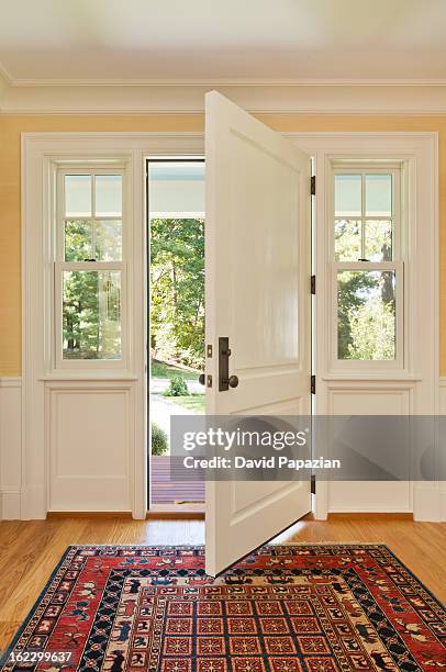 open front door of custom bulit home - house entrance interior stock pictures, royalty-free photos & images