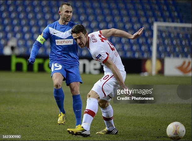 Thomas Buffel of KRC Genk competes for the ball with Christian Gentner during the UEFA Europa League round of 32 second leg match between Racing Genk...
