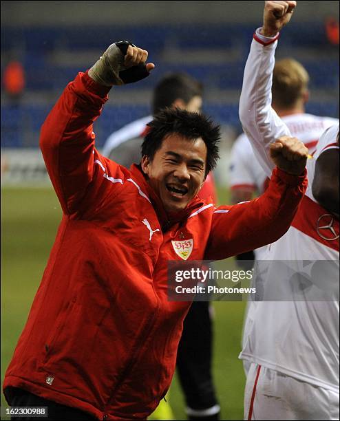 Shinji Okazaki celebrates with teammates after the UEFA Europa League round of 32 second leg match between Racing Genk and VfB Stuttgart in Cristal...