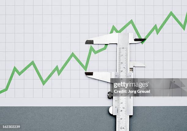 vernier caliper measuring a line graph - vernier caliper stock-fotos und bilder