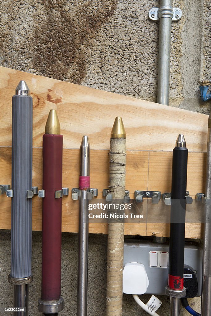 Glassblowing rods stored in workshop