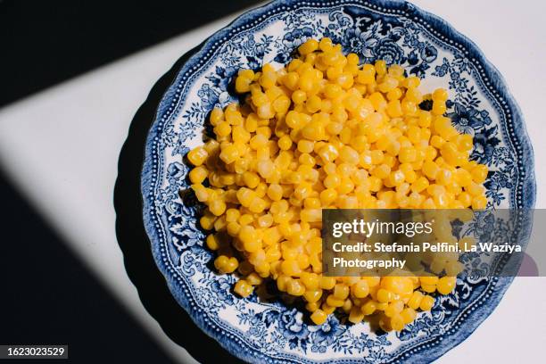sweet corn on plate - corn kernel stock pictures, royalty-free photos & images