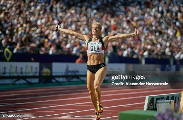 German athlete Grit Breuer her arms outstretched during the women's 400 metres event of the 2001 IAAF World Championships, held at Commonwealth...