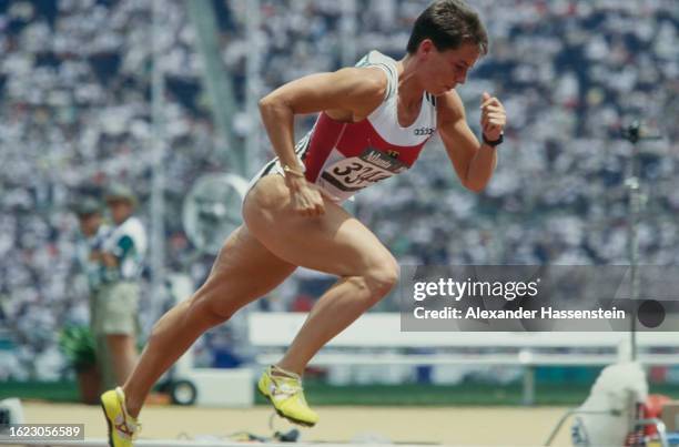 German athlete Grit Breuer during her heat in the women's 400 metres event at the 1996 Summer Olympics, held at the Centennial Olympic Stadium in...