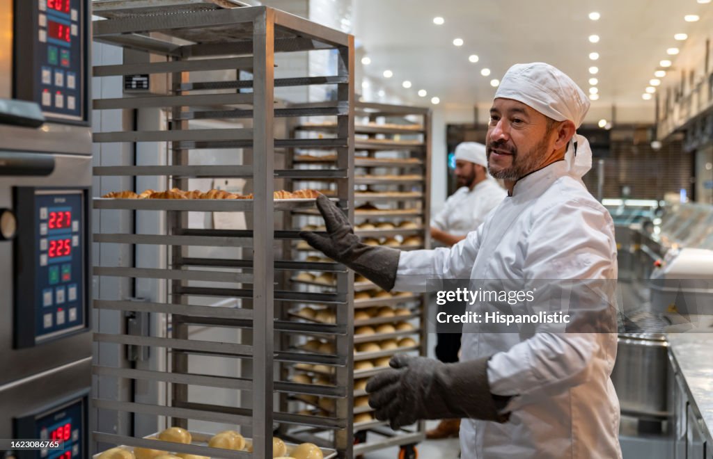 Man working at a bakery making fresh bread