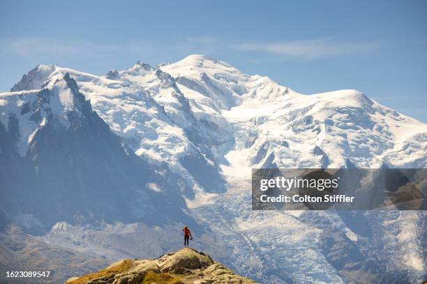 a young woman hiking in the french alps - auvergne stock-fotos und bilder