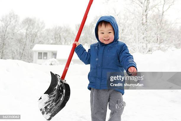 baby's winter - winter snow shovel stock pictures, royalty-free photos & images