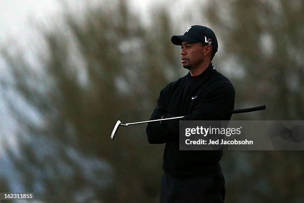 Tiger Woods looks on from the 17th green during the first round of the World Golf Championships - Accenture Match Play at the Golf Club at Dove...