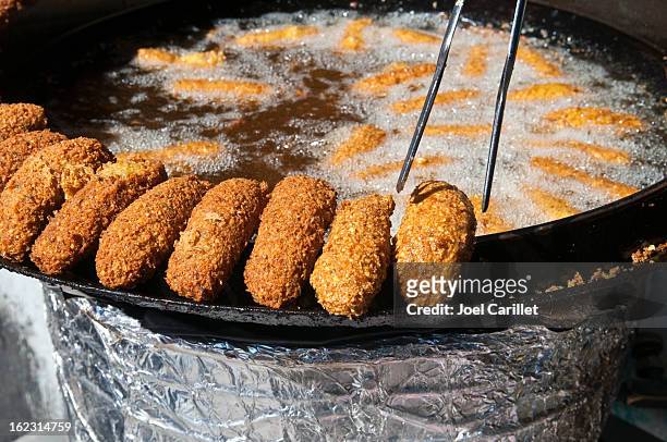 placing falafel on side of frying pan in ramallah, palestine - israel food stock pictures, royalty-free photos & images