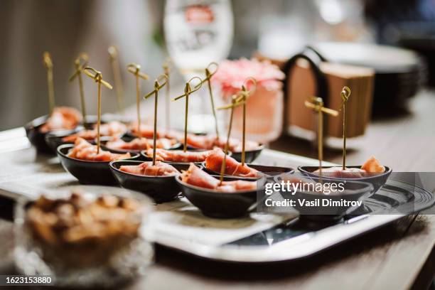 tasty bites stock photo. catering food in a bar - small dinner party stock pictures, royalty-free photos & images