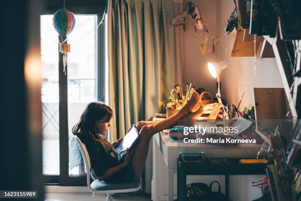 girls using digital tablet in children's room at home. - multimedia learning stock pictures, royalty-free photos & images
