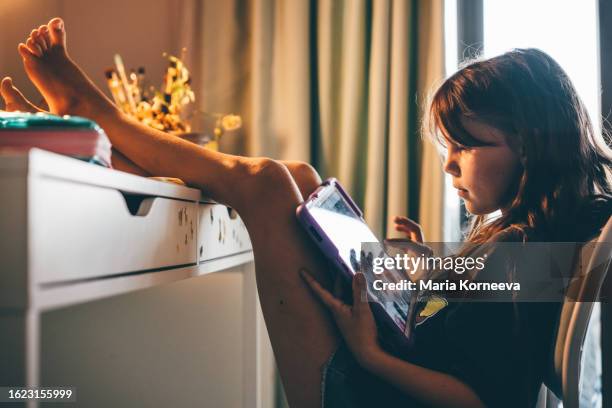 girls using digital tablet in children's room at home. - multimedia learning stock pictures, royalty-free photos & images